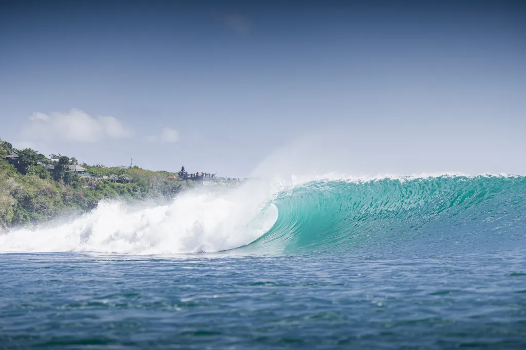 perfect dry-season wave peeling down the reef at Padang Padang