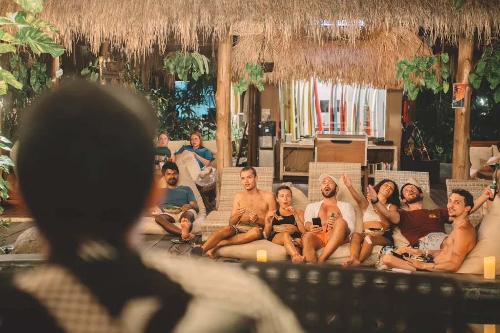 guests sitting all together watching a live music singer
