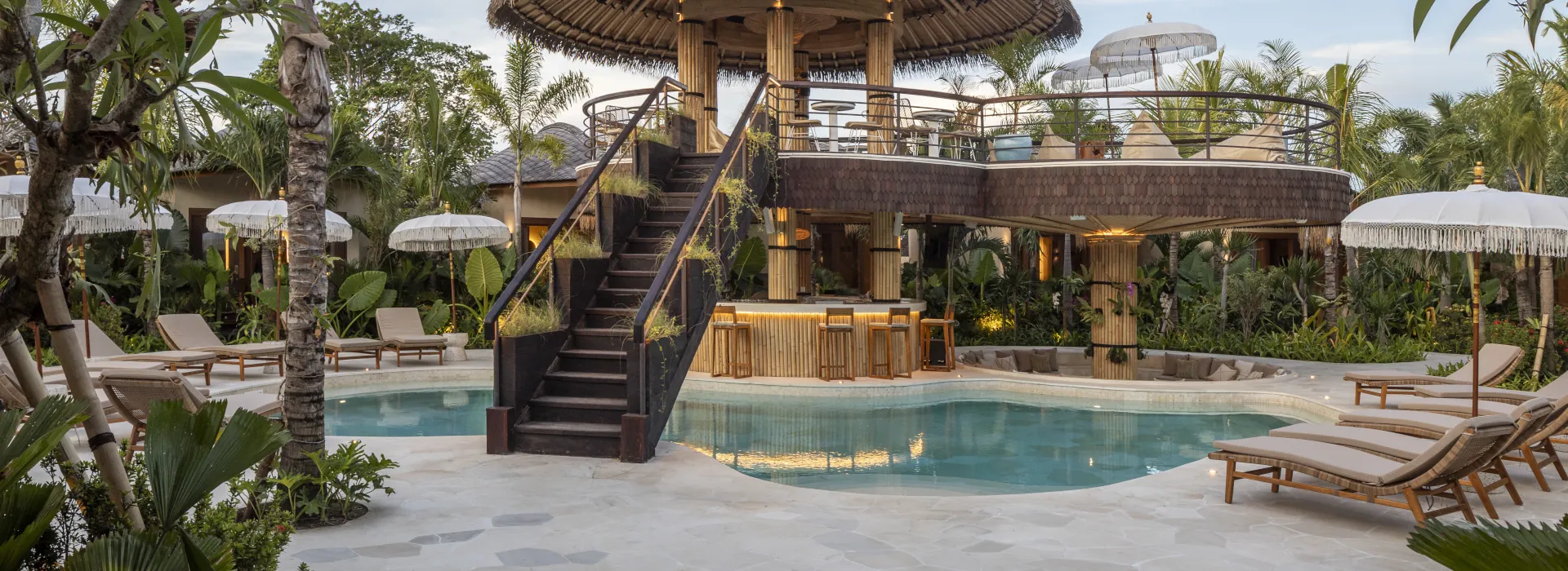 an upstairs lounging area about the main pool in our new surf camp in Uluwatu.
