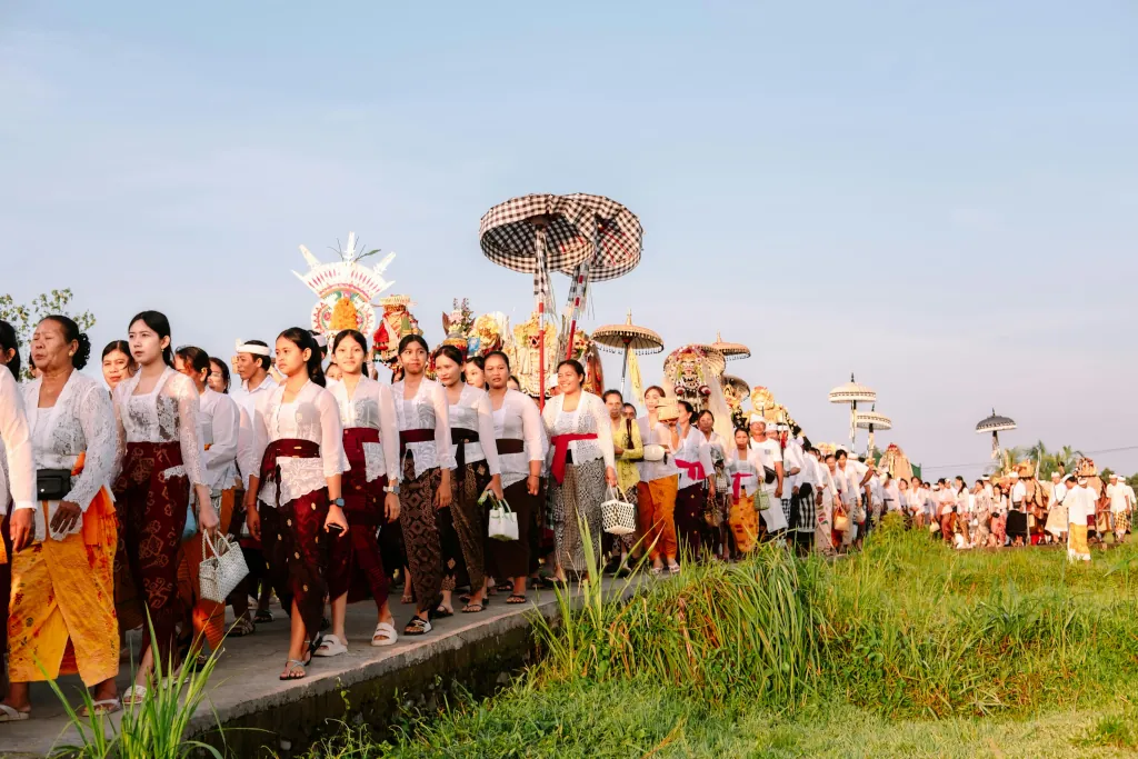procession-of-people-in-traditional-attire-walking-outdoors