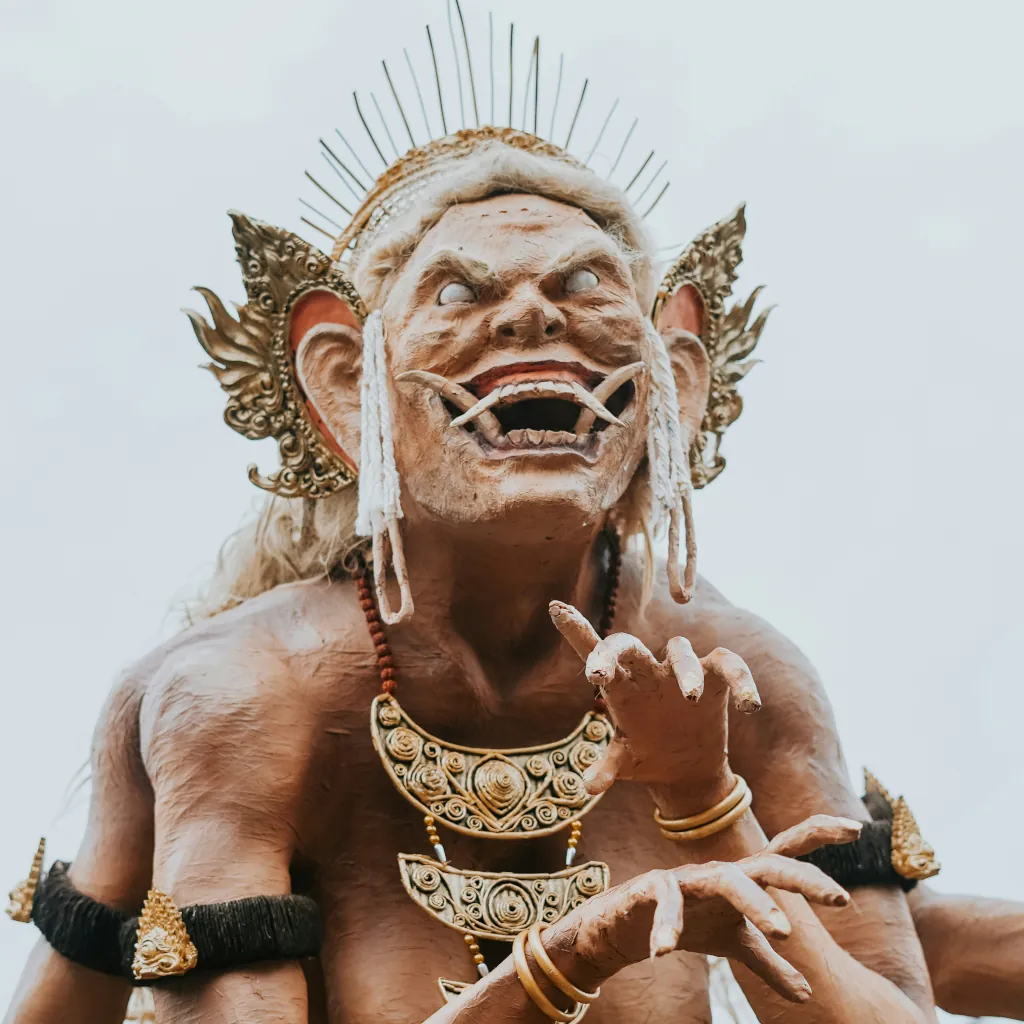 a-frightening-balinese-demon-statue-with-ornate-headdress-and-jewelry