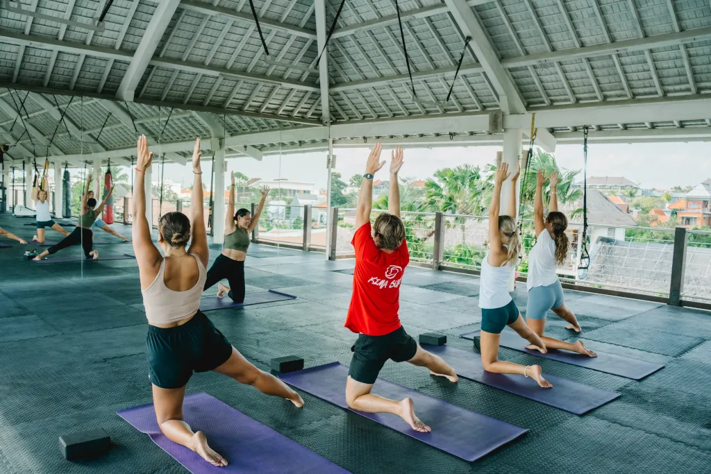 PEOPLE DOING YOGA AT KIMA SURF CAMPS