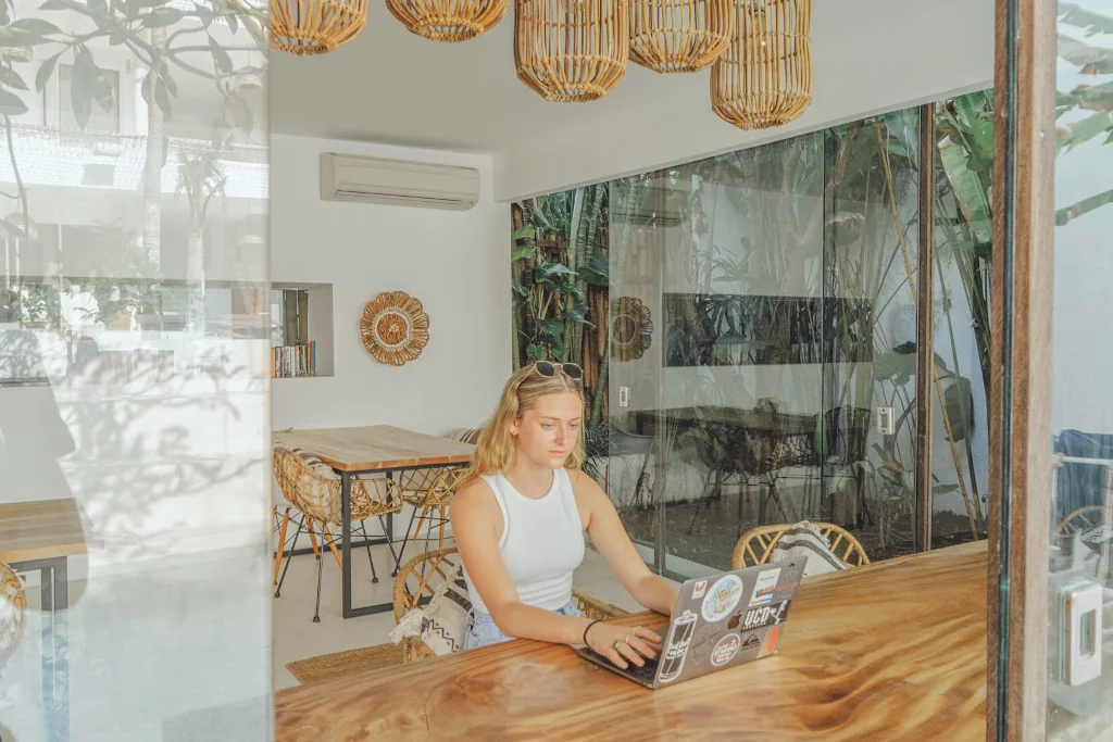 A woman working on her laptop in Kima coworking space