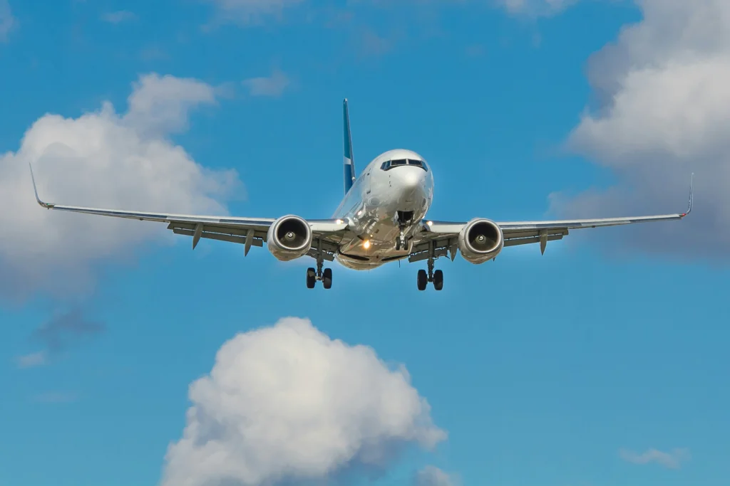 airplane mid flight in a blue sky