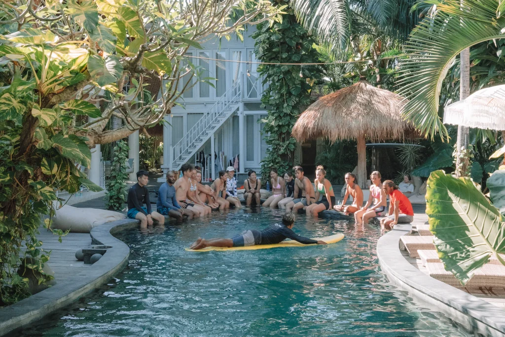 people gathered around the pool