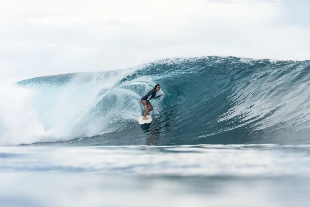 Giada surfing in a barrel in the Mentawais