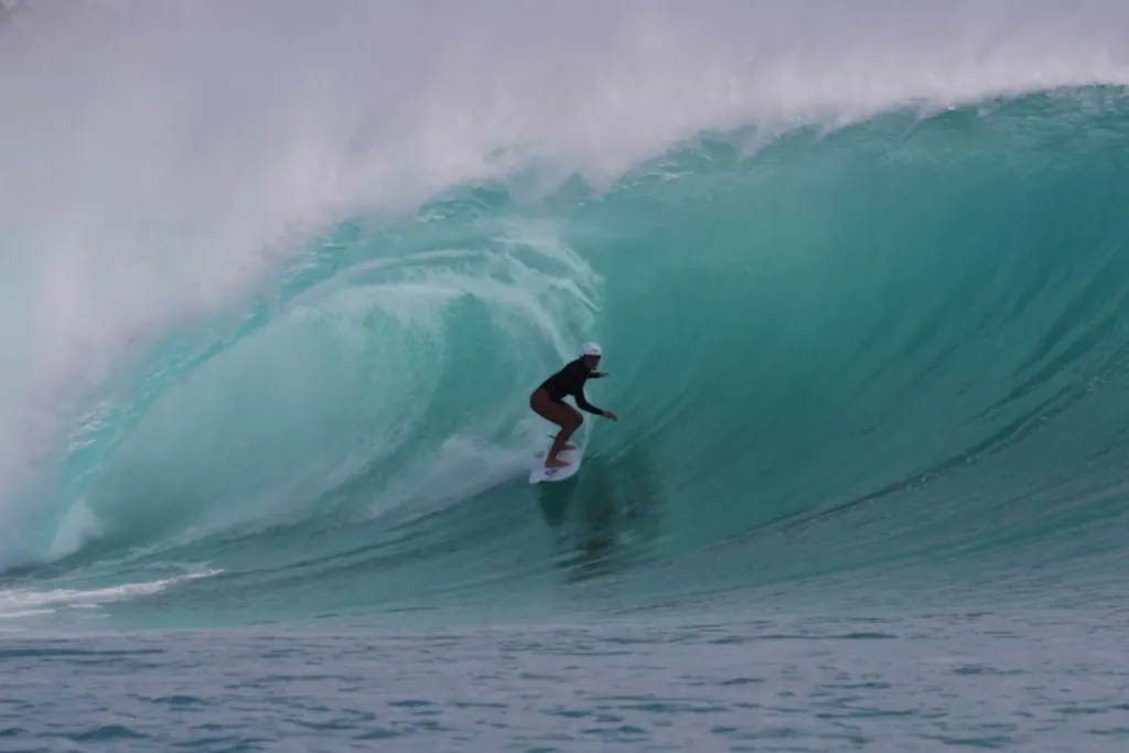 Giada surfing a heavy barrel