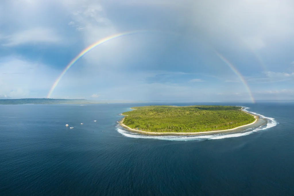 ISLAND IN THE MENTAWAI WITH A RAINBOW OVER IT